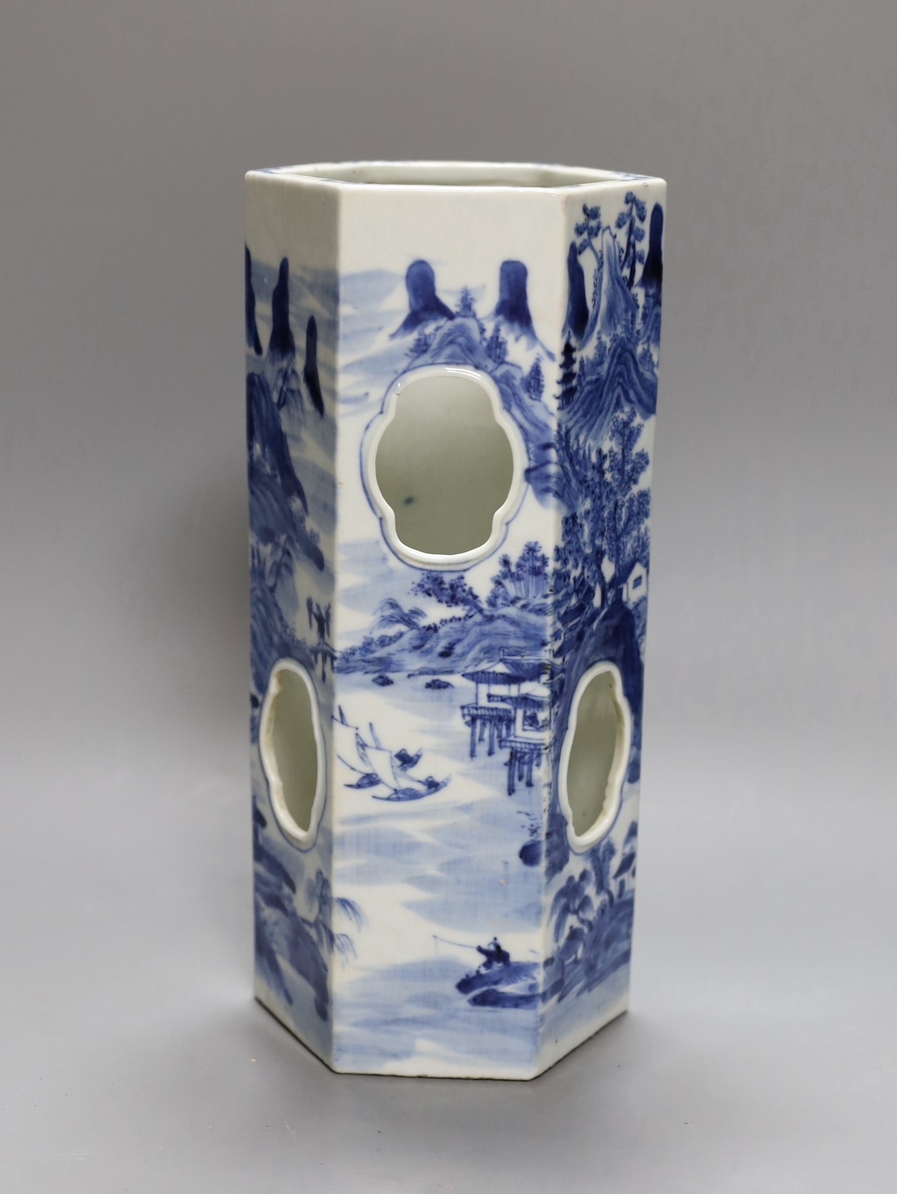 A Chinese blue and white hexagonal hat stand, late 19th century, 27.5 cms high, 27.2 cm high, hairline crack to one side of body